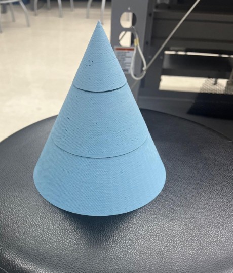 The 3D-printed light blue cone nose